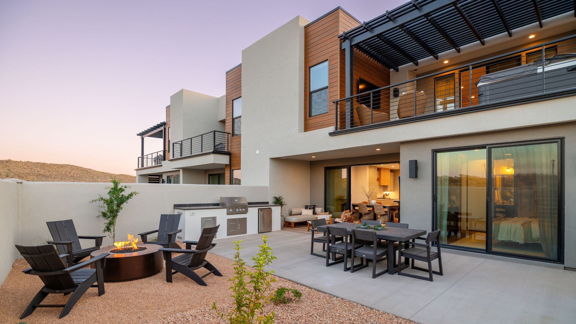 Isle vacation rental exterior with landscaped backyard in Washington, Utah — purpose-built STR townhome at Coral Canyon