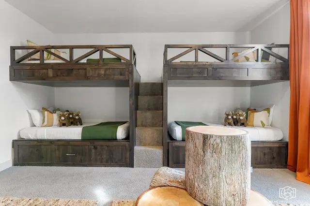 Bunk room with built-in beds and warm accents