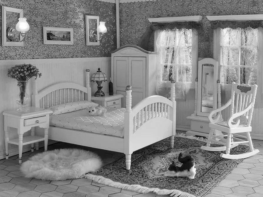 Detailed miniature bedroom inside a wooden dollhouse