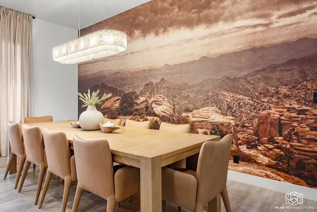 Dining room with a desert mural and long table