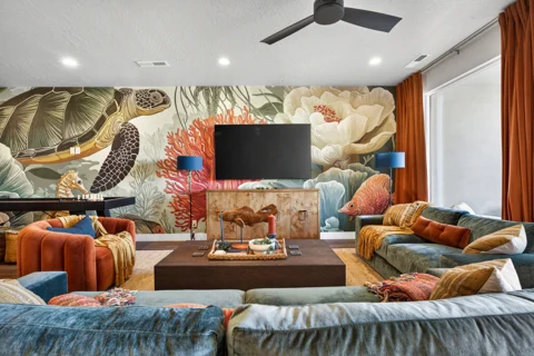 Sea-turtle lounge with blue seating and colorful round chairs