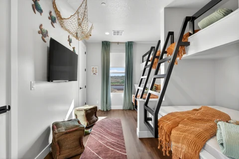 Bunk room with dark ladders and copper throws