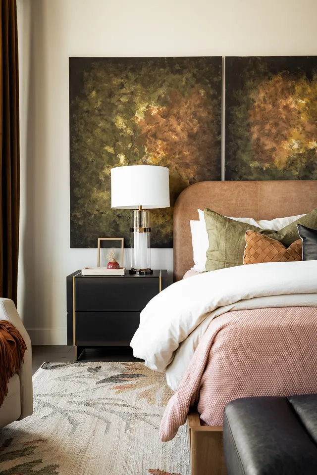 Belmont Avenue bedroom with layered textiles and artwork
