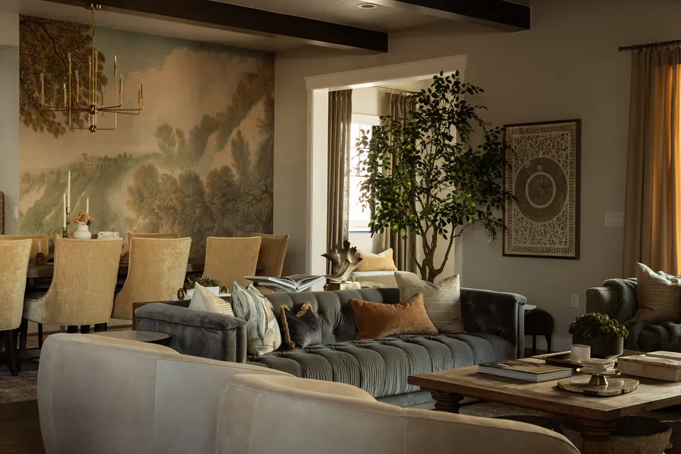 Layered living and dining room with a landscape mural at Blue Pearl Alley