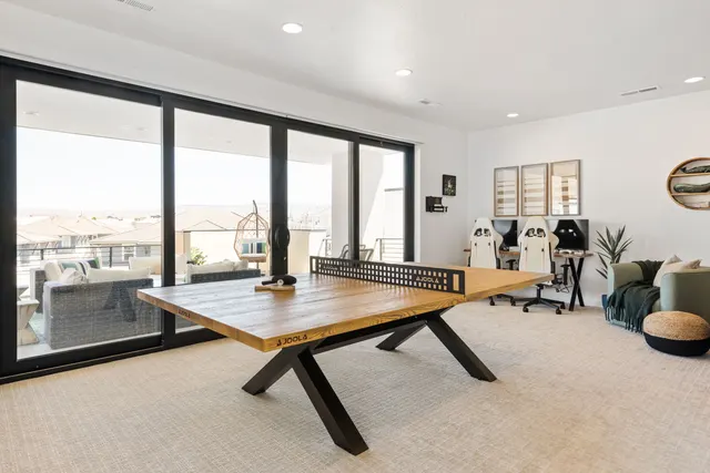 Table-tennis area beside broad glass doors