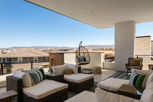 Covered patio seating overlooking the landscape
