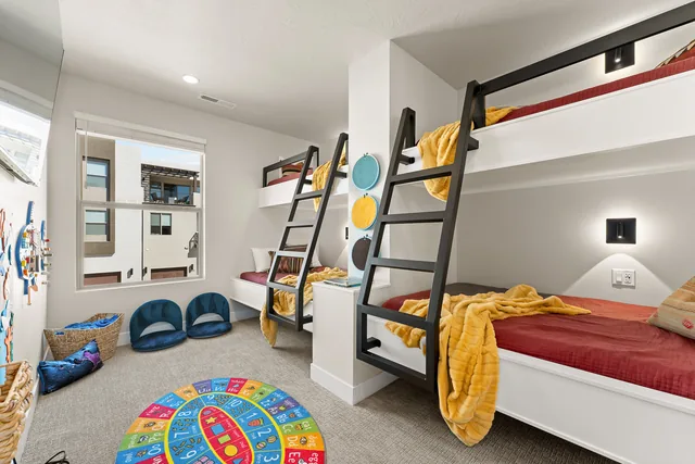 Colorful bunk room with playful bedding