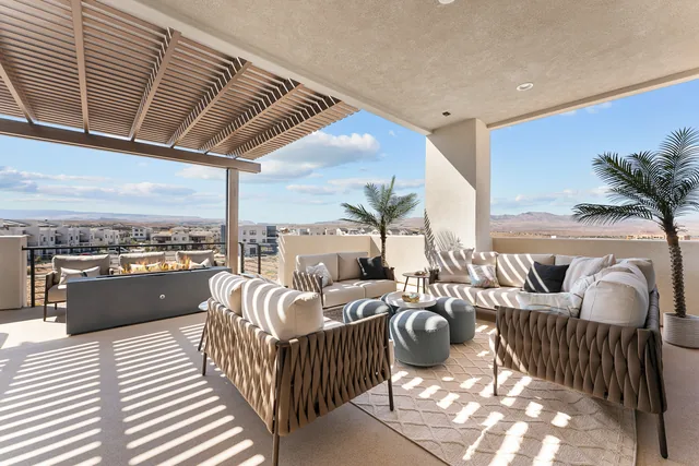 Outdoor lounge with sectional seating and neighborhood views