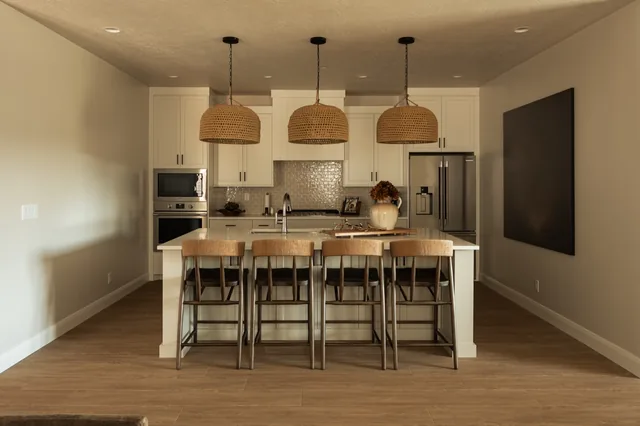 Open kitchen with woven pendant lights