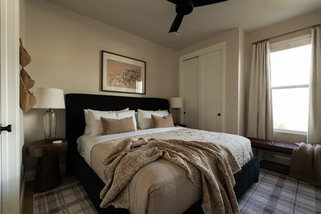 Guest bedroom with layered neutral bedding