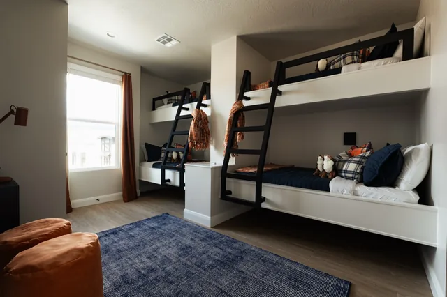 Bunk room with a landscape mural
